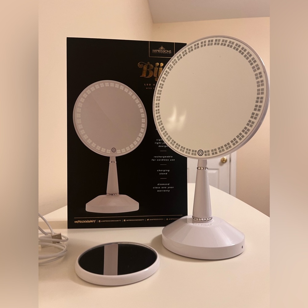 Impressions Vanity Bijou LED Hand Mirror with charging station